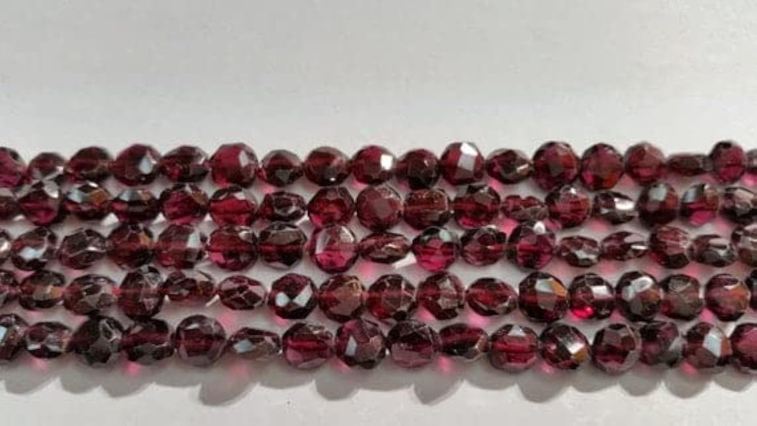 Garnet Faceted Buff Coin 7mm : transmettez une émotion éternelle grâce aux perles de grenat véritable