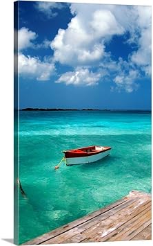 GREATBIGCANVAS Boat in Water, Eagle Beach, Aruba Canvas Wall Art Print, Coastal Home Decor Artwork, 22"x36"x1.5"