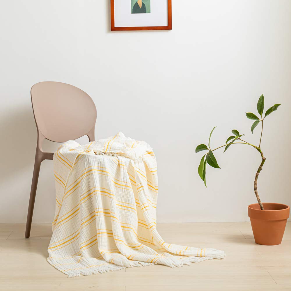 Couvre-lit en coton à pompons pour illuminer votre salon