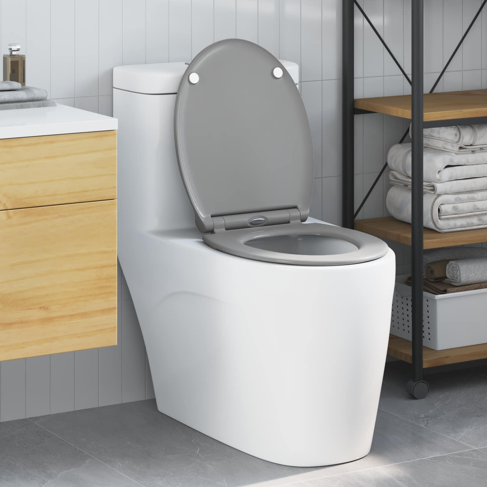 Sedile WC moderno in polipropilene grigio 47 x 37,5 x 3,8 cm, dal design sobrio e di facile montaggio per bagni interni.
