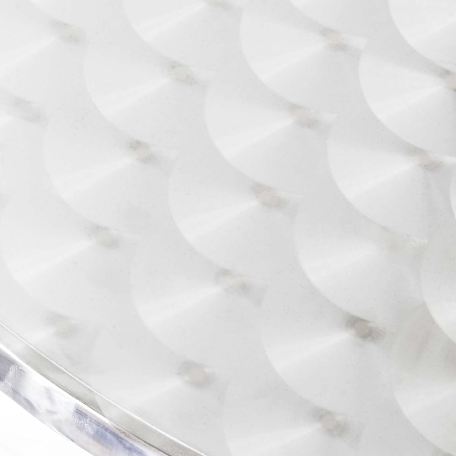 Primer pla view of the textured aluminum tabletop surface.