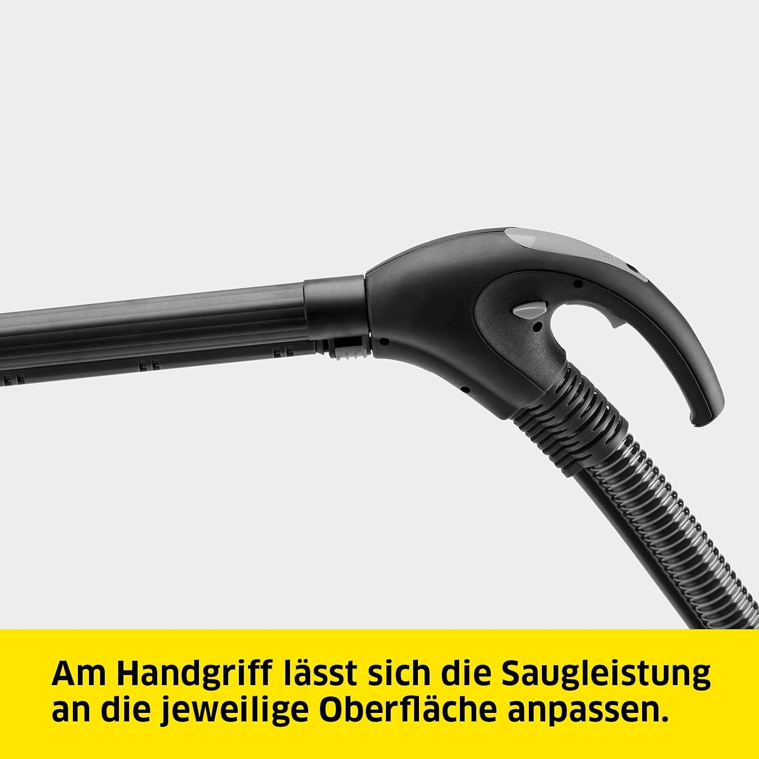 Close-up of the Kärcher SV 7 handle with controls for suction power