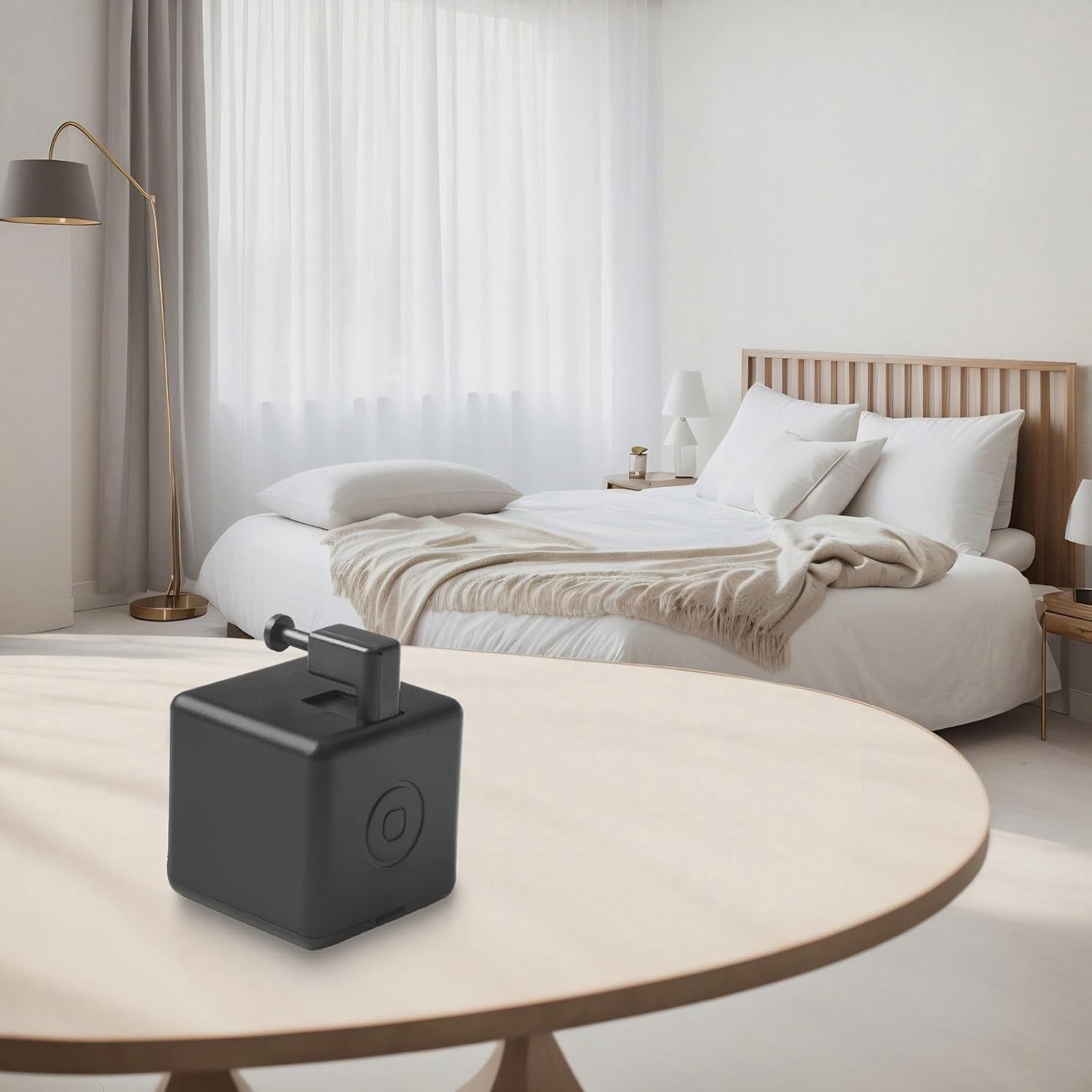 Smart Button Pusher installed on a table next to a lamp switch