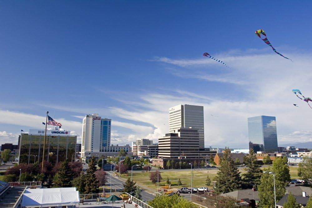 Kites Flying In Park Strip With Downtown Anchorage In