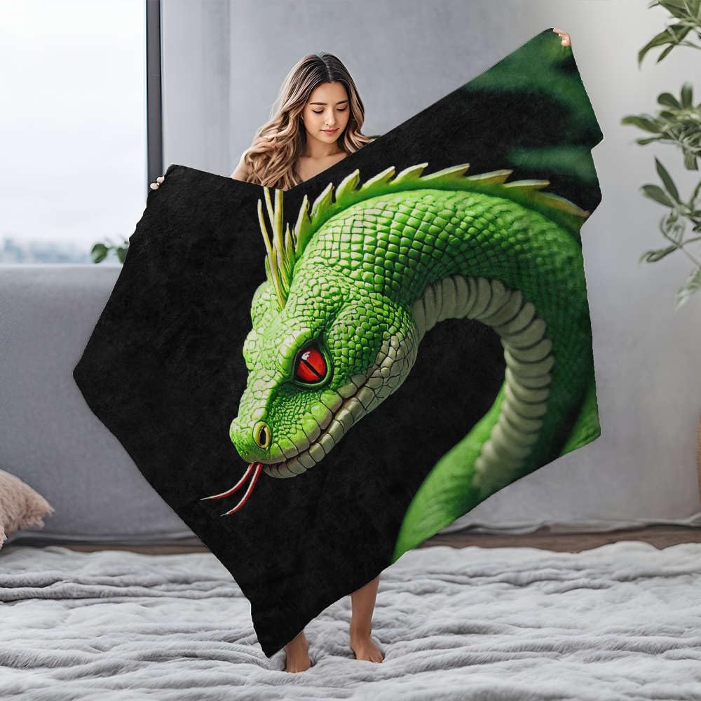 Couverture flanelle serpent vert pour des soirées cocooning canapé