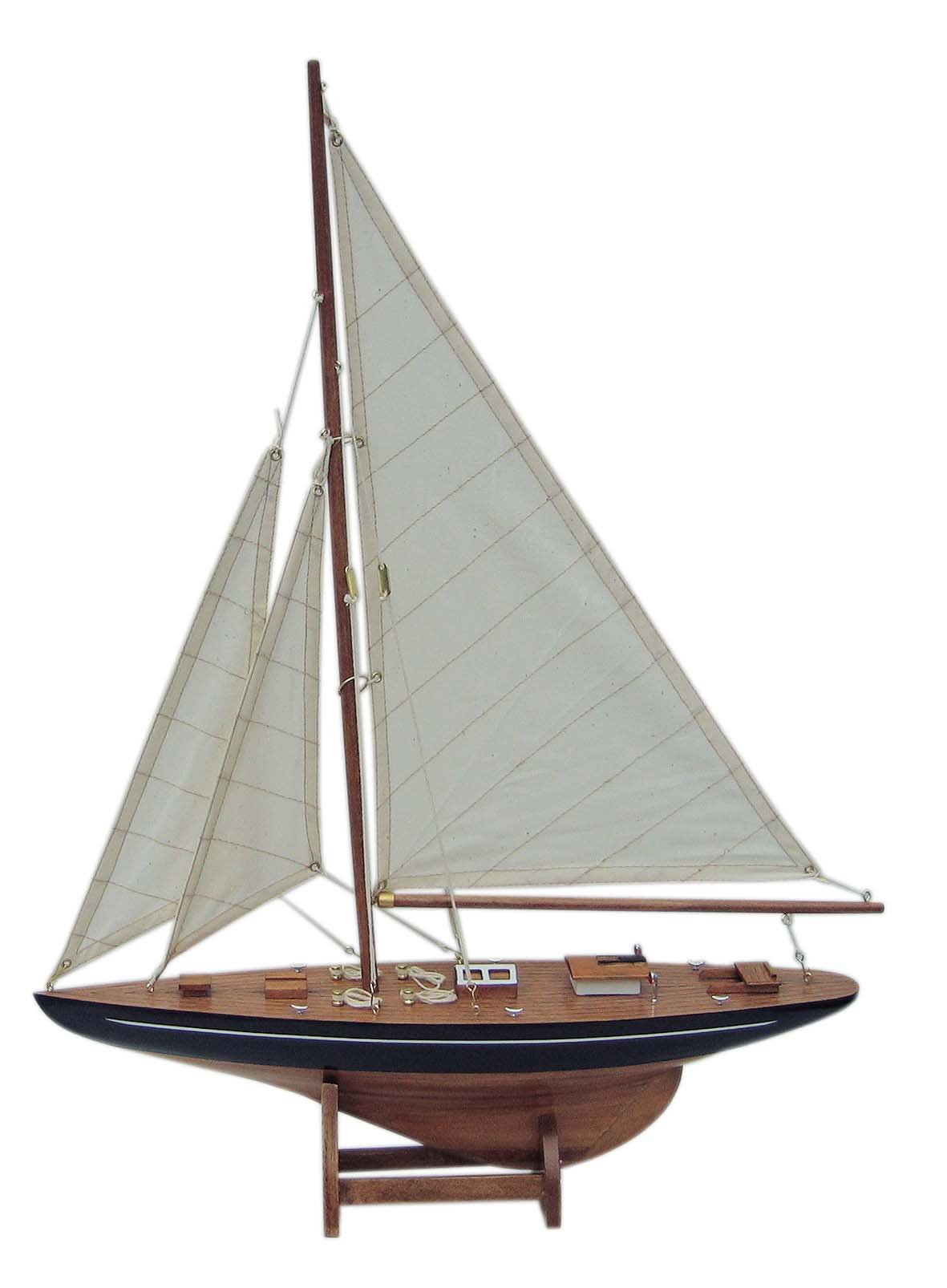 Segelyacht Einmaster mit Segel aus Stoff und Holzständer