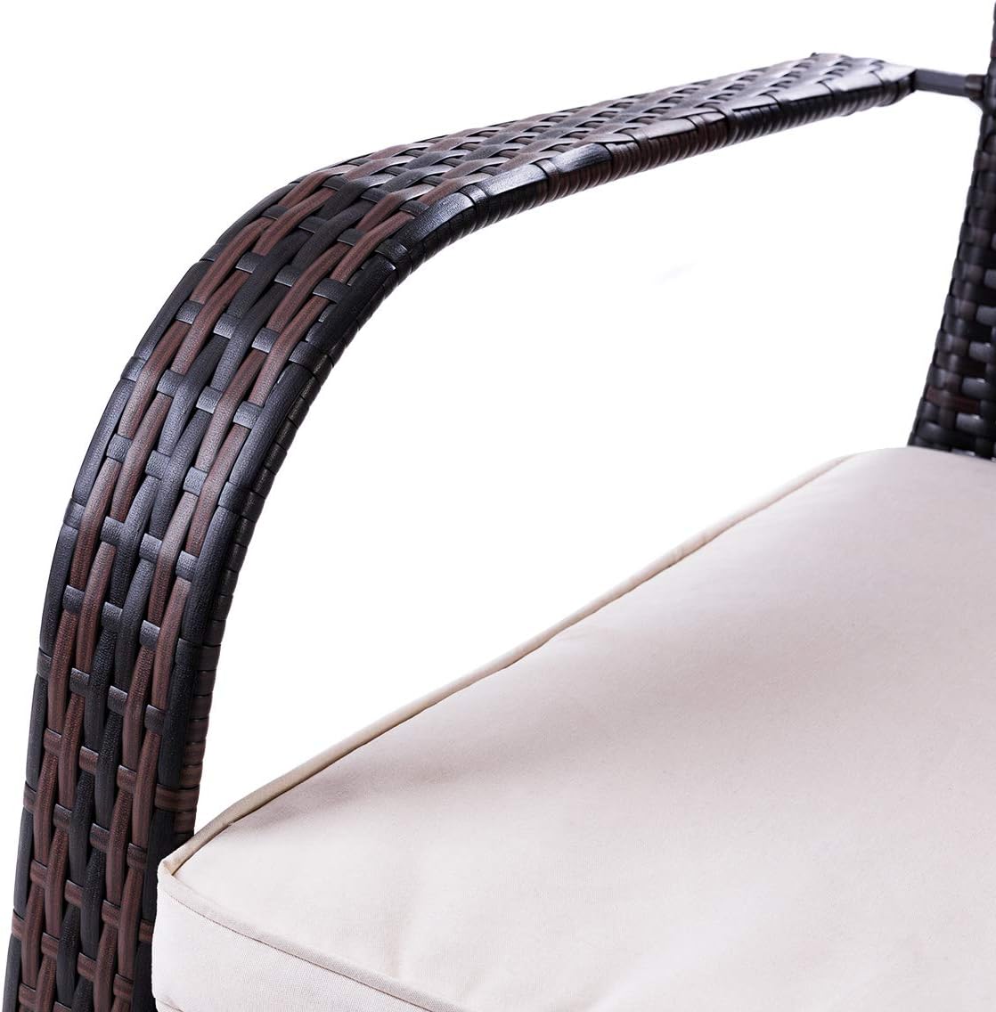 Close-up of the curved armrest of the rattan armchair
