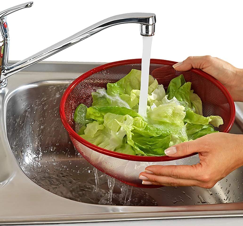 Hands washing lettuce in the BOTEX Apple Shape Net Fruits & Vegetables Basket under a faucet
