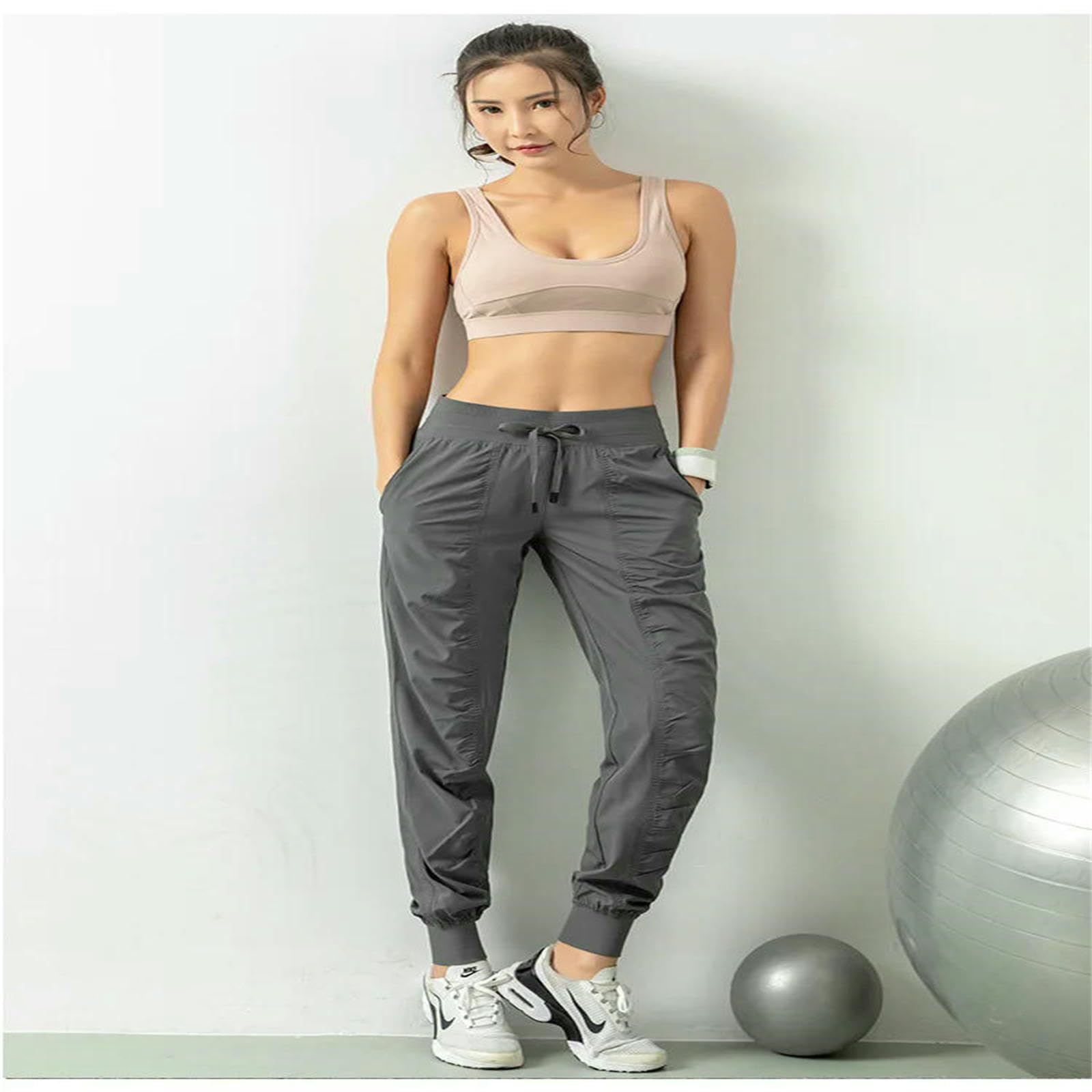 Spodnie damskie plisowane spodnie legginsy fitness spodnie sportowe luźne spodnie ze sznurkiem do biegania na co dzień