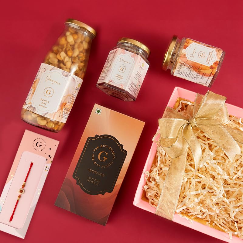 Image of THE GIFT STUDIO.COM | Rudraksha Bliss Rakhi Hamper for Brother | Rudraksha Rakhi, Almond Brittle, Roasted Cashews, Smoked Almonds & Party Mix | Rakhi Gift Hamper