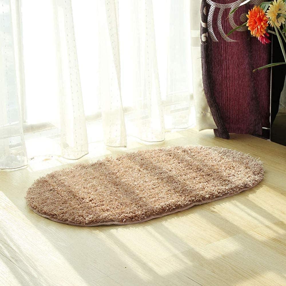 Tapis d'une salle de bain jaune ovale idéal pour illuminer votre buanderie