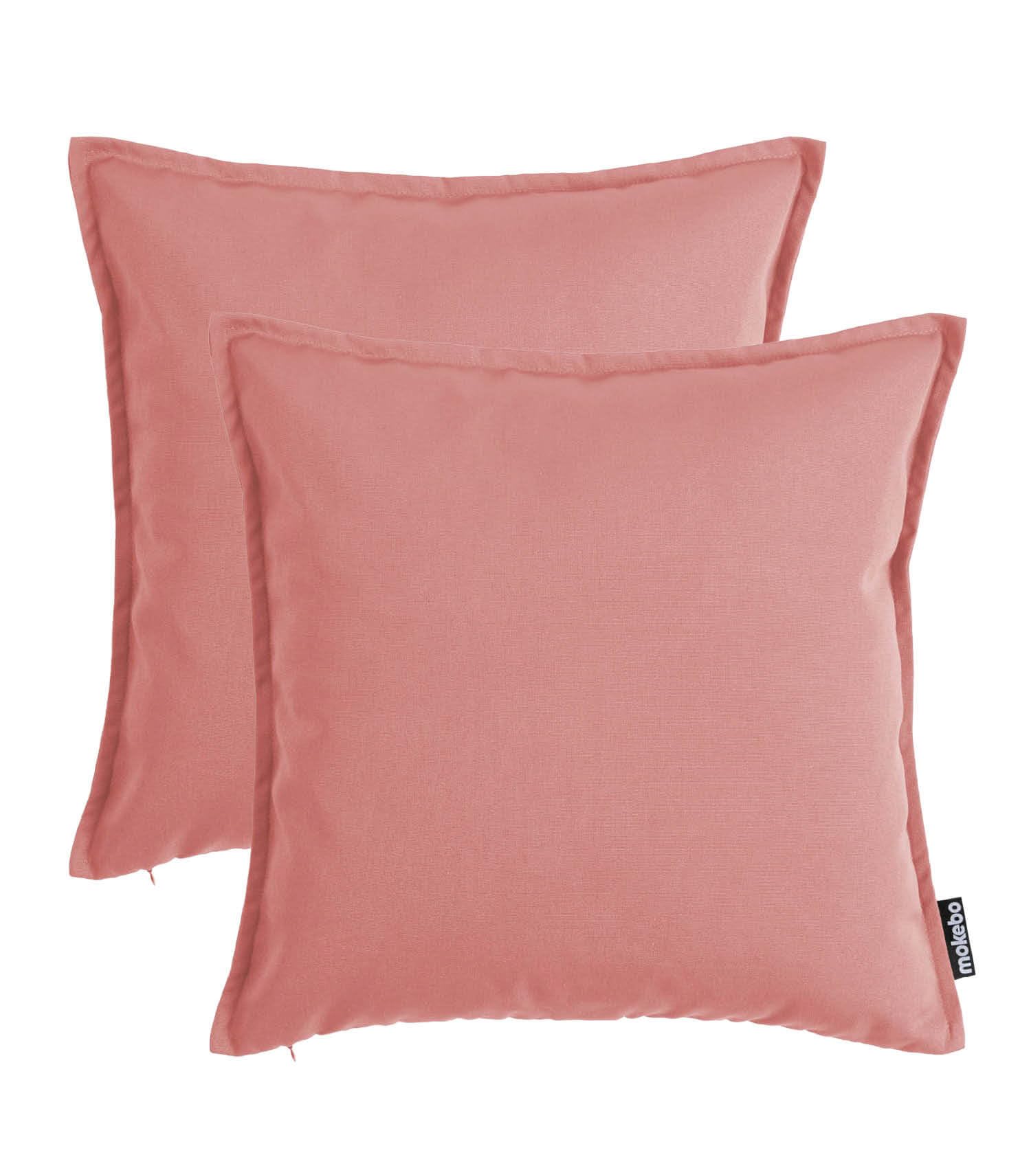 mokebo® Outdoor Kissen 'Die Auszeit' 2er-Set, (45x45cm) Terrassendeko, Sofakissen oder Kissen für Balkon, Terasse oder Garten, Dekokissen Bezug aus feinem Outdoorstoff in Koralle