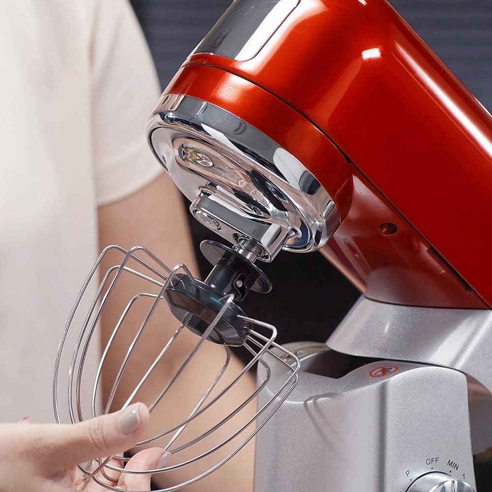 Hand attaching whisk to MasterChef mixer