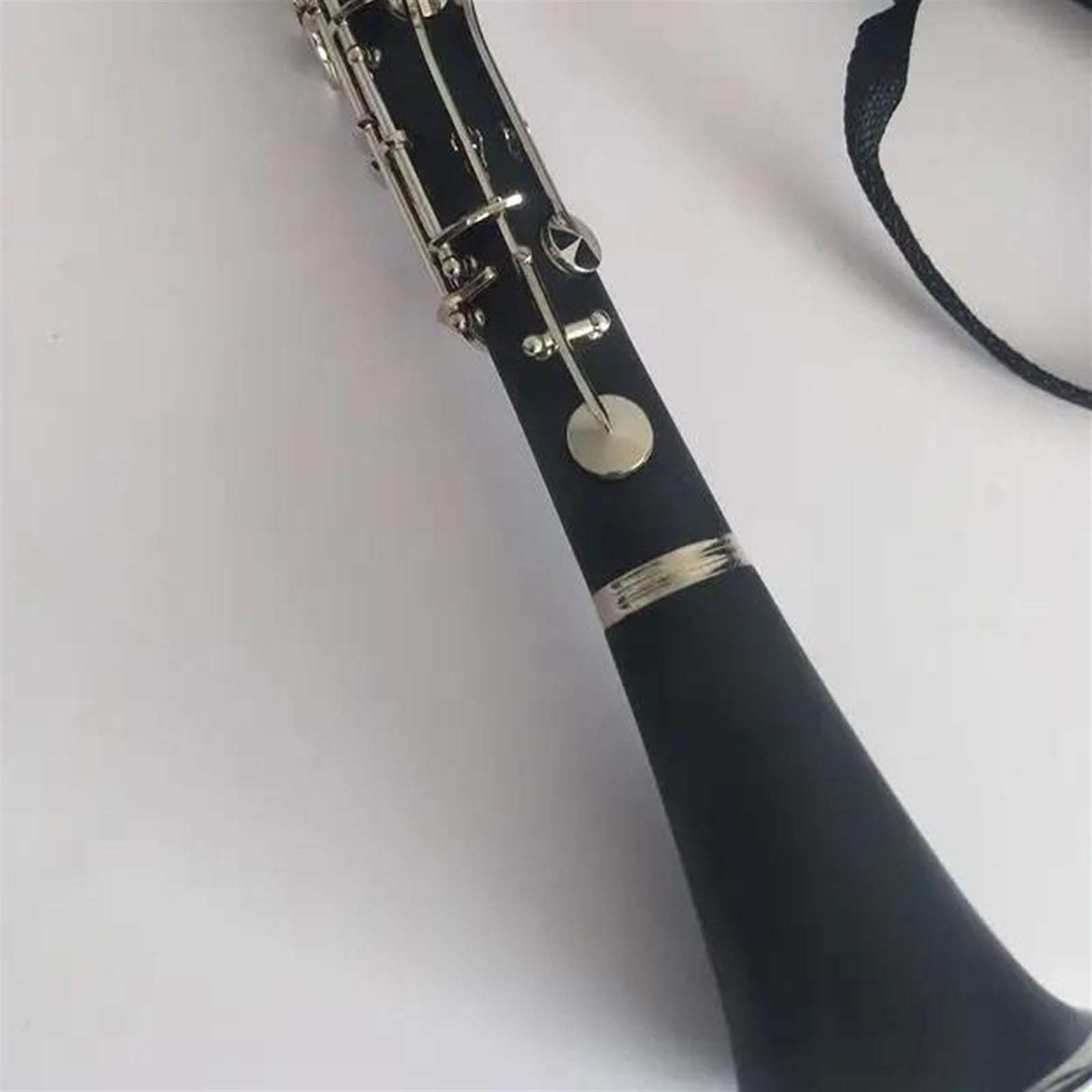 Instrumento de clarinete de 18 teclas en tecla G Cuerpo de baquelita Superficie niquelada Clarinete Profesional