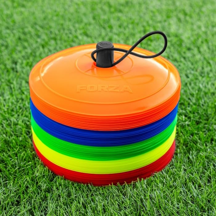 Stack of colorful flat training cones with a black carrying strap on grass