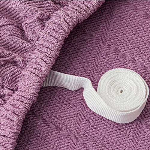 Housse de canapé extensible rose pour protéger le fauteuil du salon