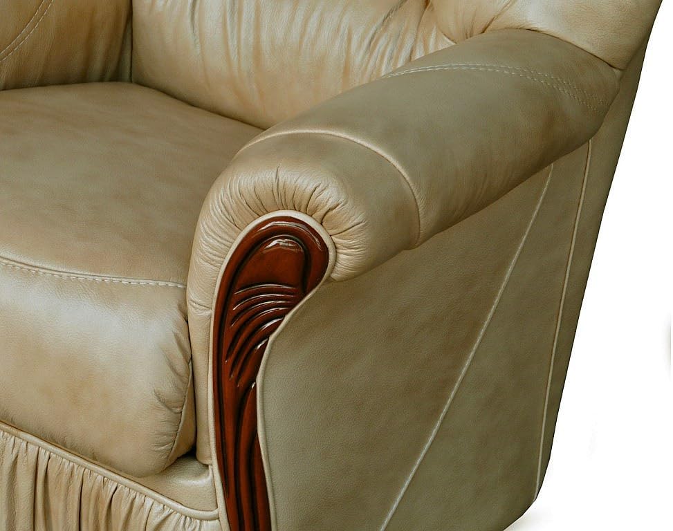 Close-up of the sculpted wooden armrest on the Daphne sofa