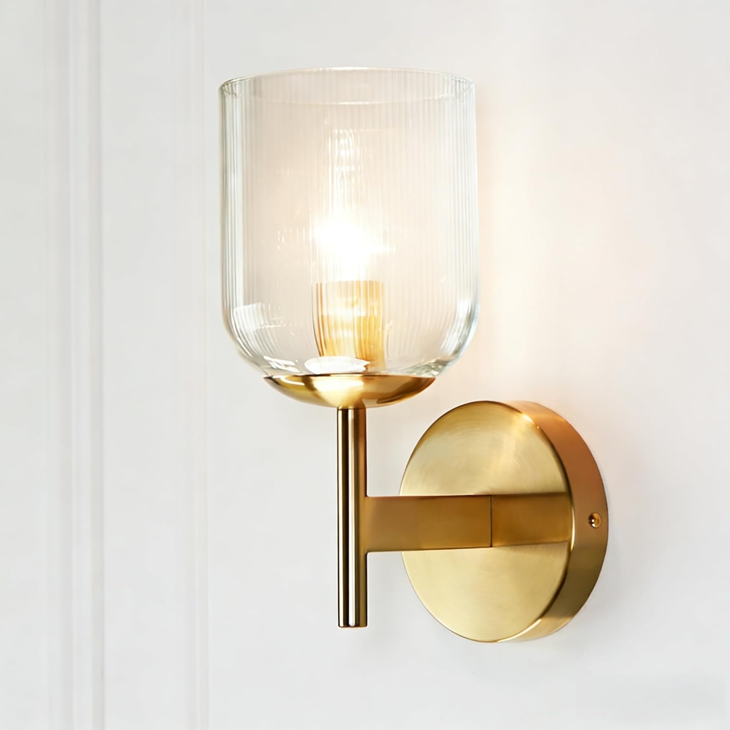 Modern Brass Fluted Glass Wall Sconce, Wall Mounted Light with Aged Brass Base - Clear Ribbed Glass Shade for Bedroom, Dining Room or Above/Beside Mirror
