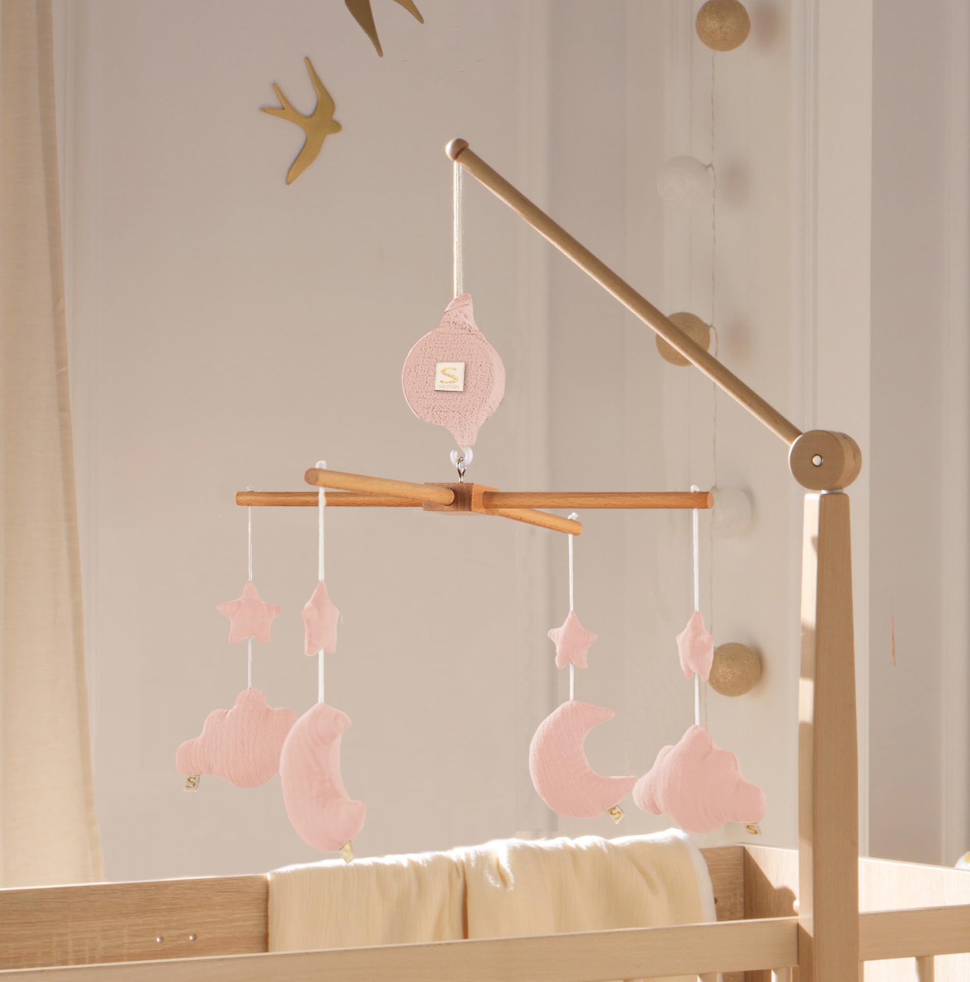 Mobile musical bébé en bois avec 4 jouets