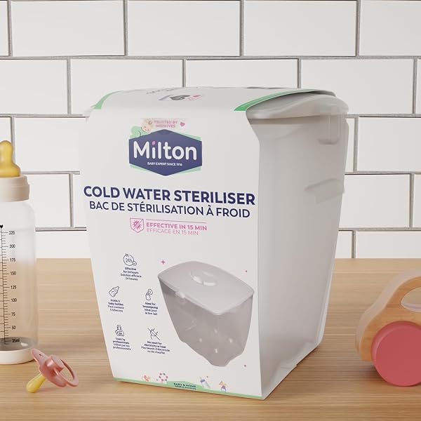 Milton Cold Water Steriliser unit filled with sterilising solution, ready for baby bottles.