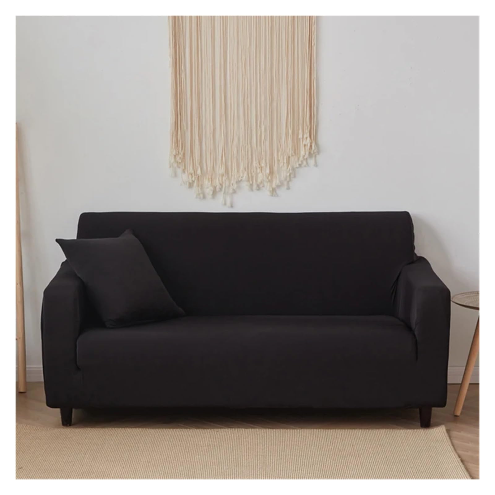Housse de canapé extensible pour rénover un divan usé noir