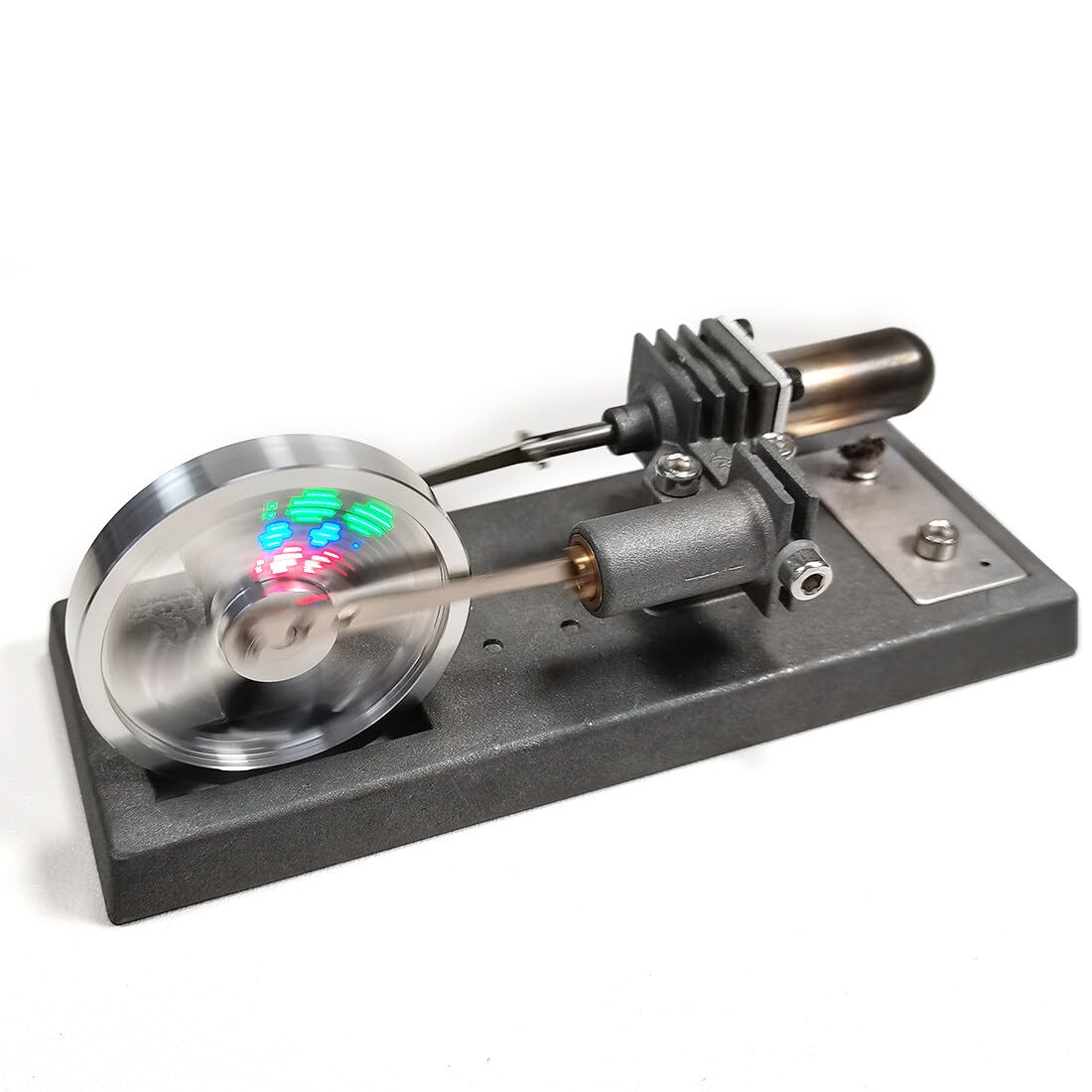 Kit motore Stirling con volano luminoso, 12 × 6 × 6 cm | Il volano luminoso completa il meccanismo autoassemblato con un effetto luminoso visibile.