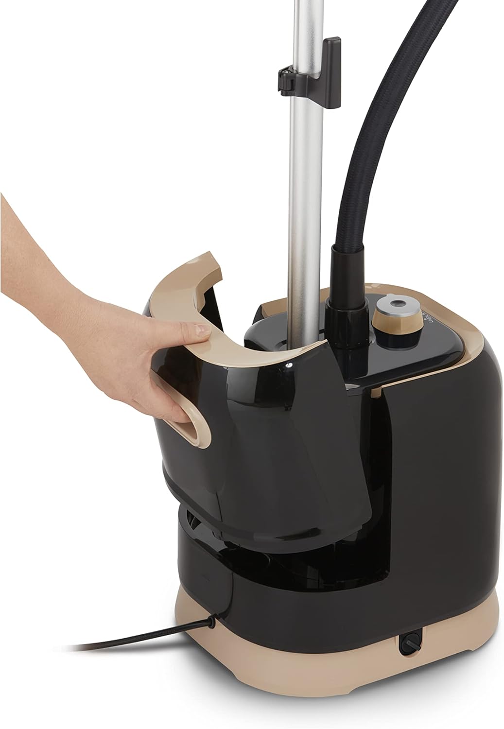 User steaming a shirt on the integrated hanger of the Tefal ProStyle Garment Steamer.