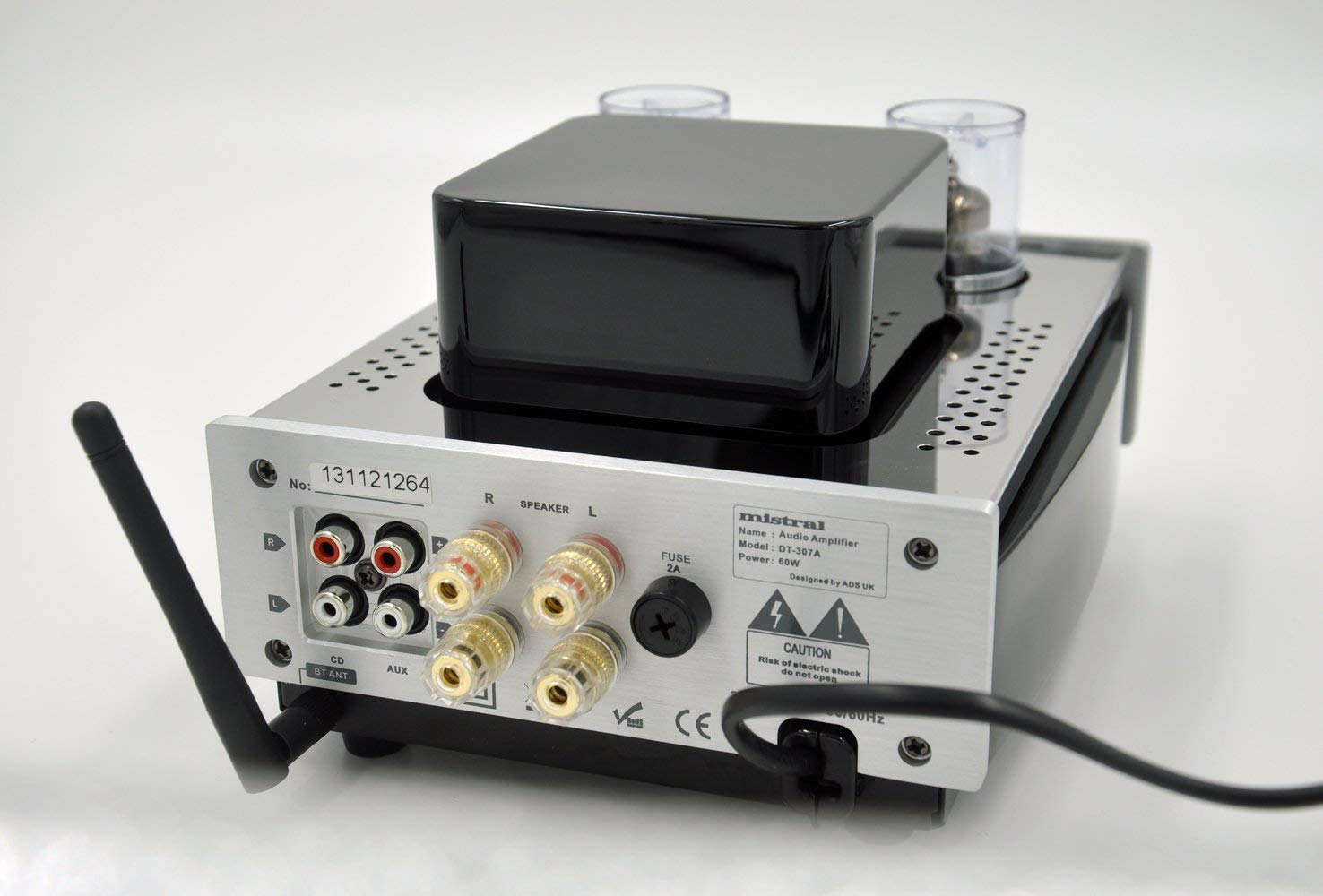 Rear view of the Mistral DT-307B amplifier, showing RCA inputs for CD and AUX, speaker output terminals, Bluetooth antenna port, and power input.