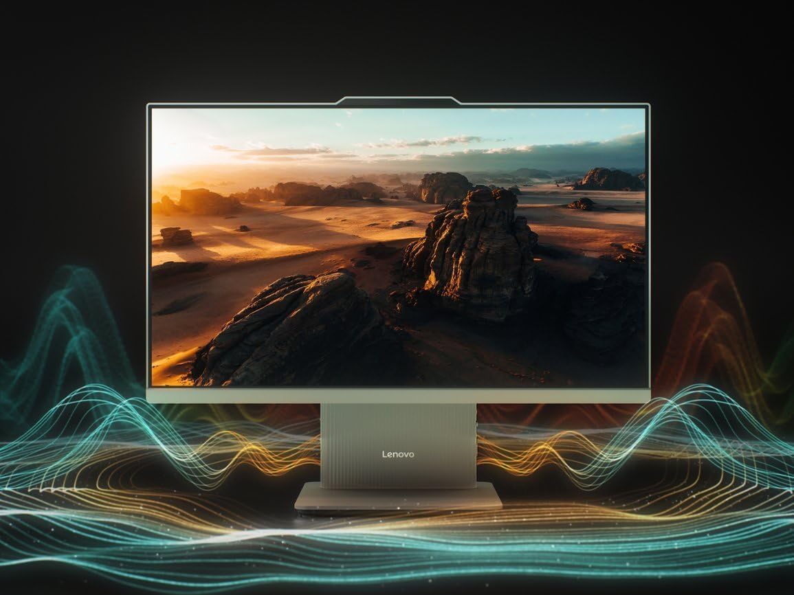 Front view of the Lenovo All-in-One Desktop displaying a scenic landscape. Abstract sound wave graphics emanate from the sides of the monitor, illustrating its audio capabilities.