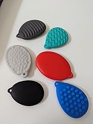 6 small, flat egg shaped silicone discs with different textures on each side. They are all different colors.