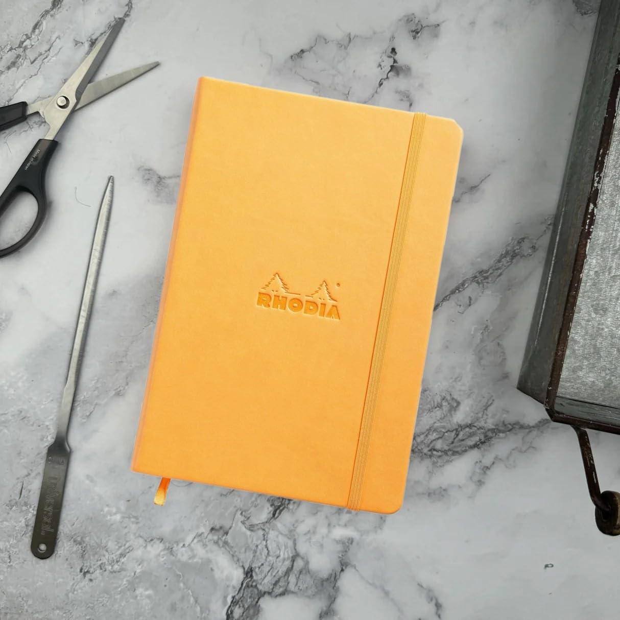 Rhodia 118608C - Rigid Notebook Webnotebook Orange - A5 - Lined - 192 Pages - Clairefontaine Ivory Paper 90 g/m - Bookmark, Elastic Closure - Faux Leather Cover