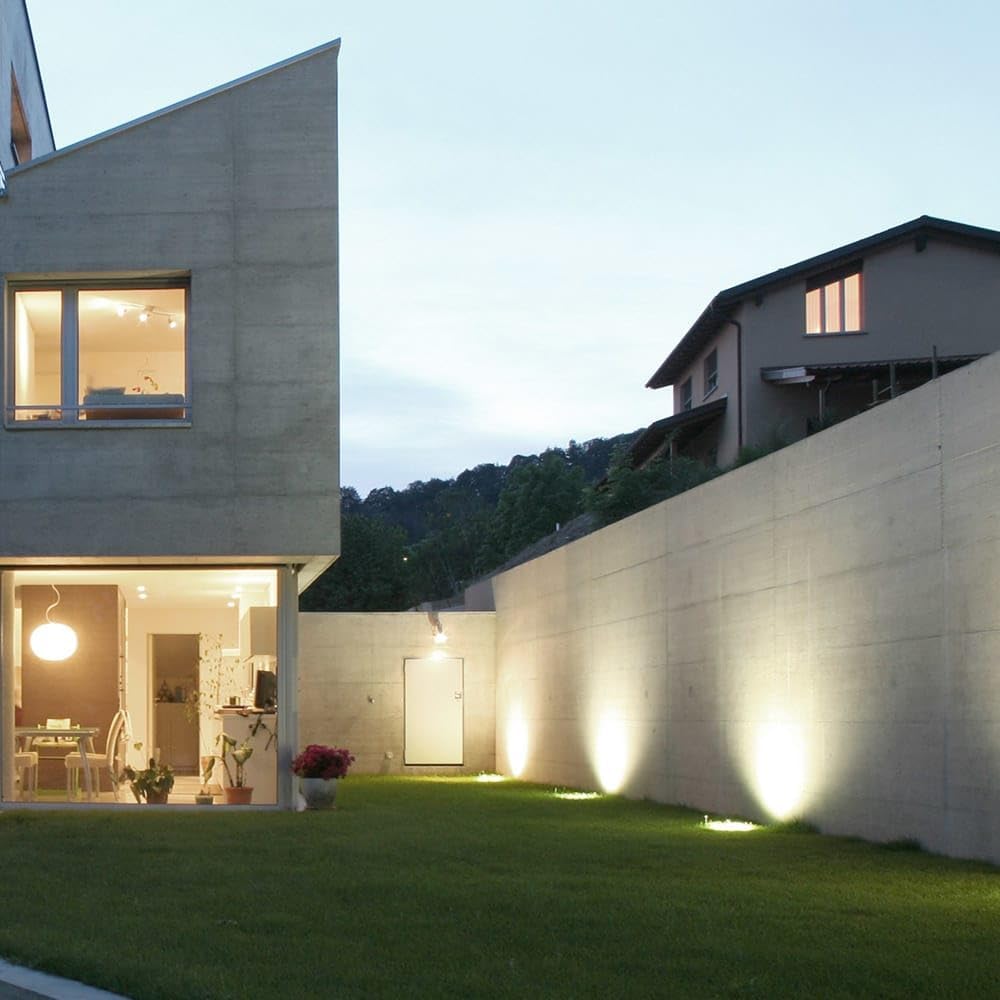 HOFTRONIC Maisy recessed spot lights illuminating a garden path next to a modern house