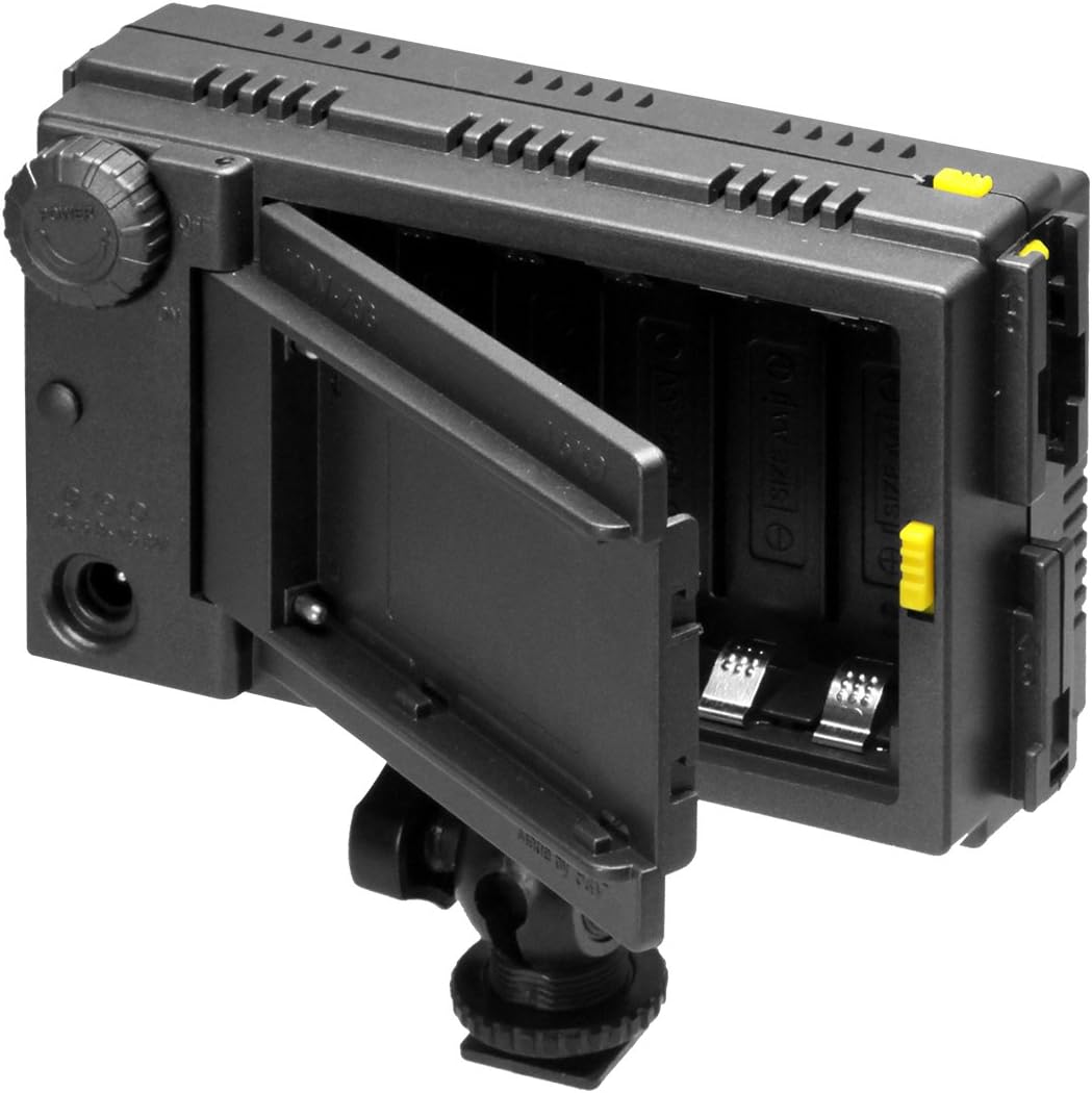 F&V HDV-Z96 LED light with the battery compartment open, showing AA battery slots