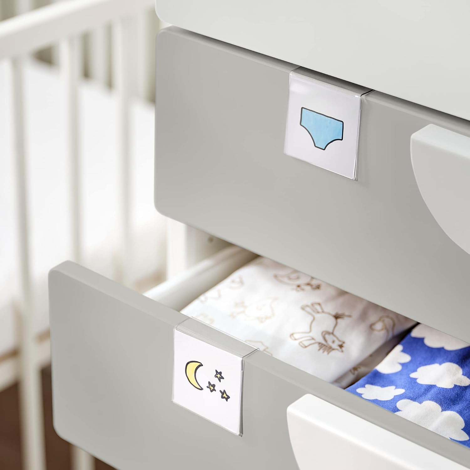 Close-up of IKEA SMÅSTAD changing table drawers with internal organizers and labels