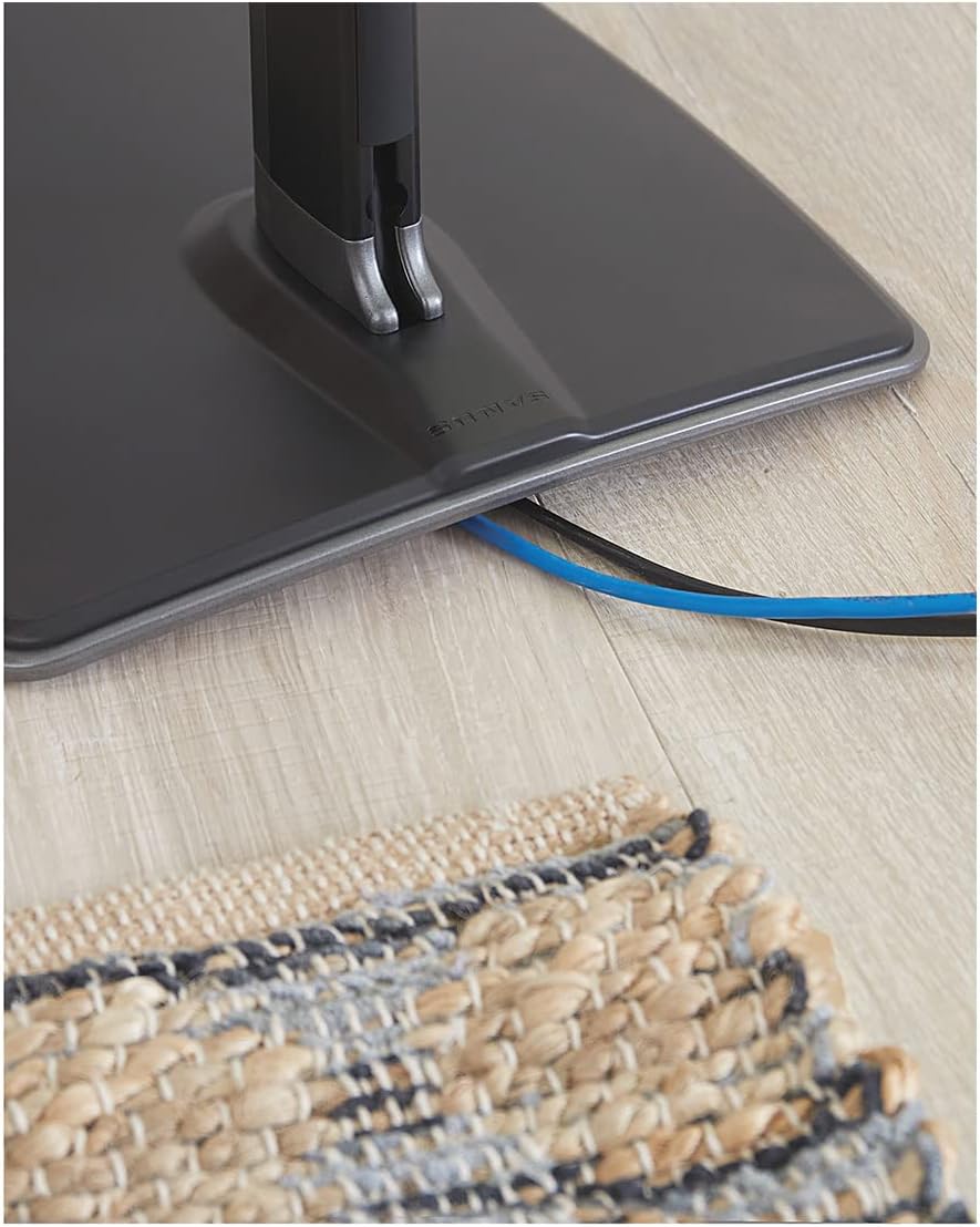 Cables routed through the base of the speaker stand