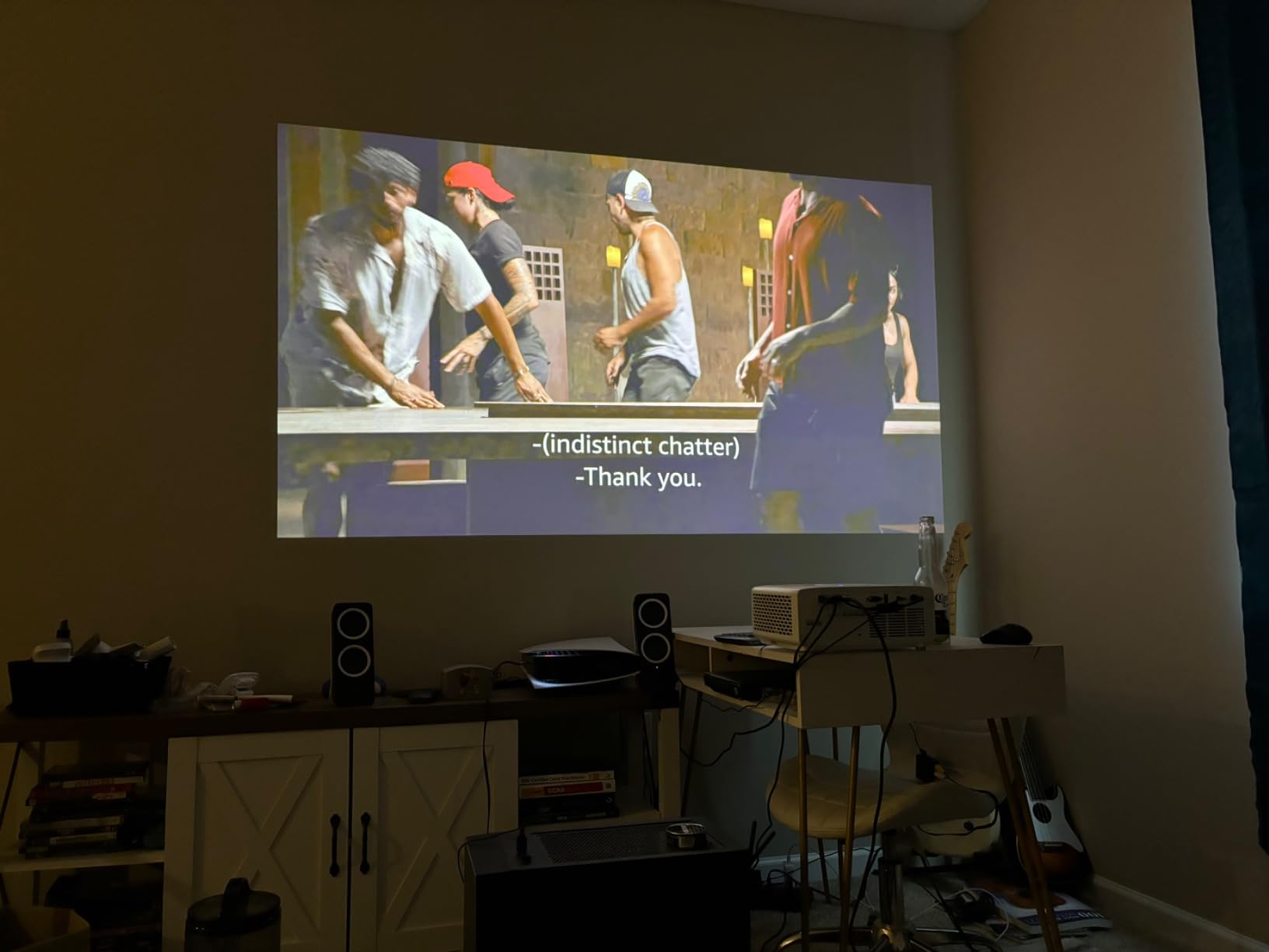 Optoma projector review lineup shown against a home theater backdrop