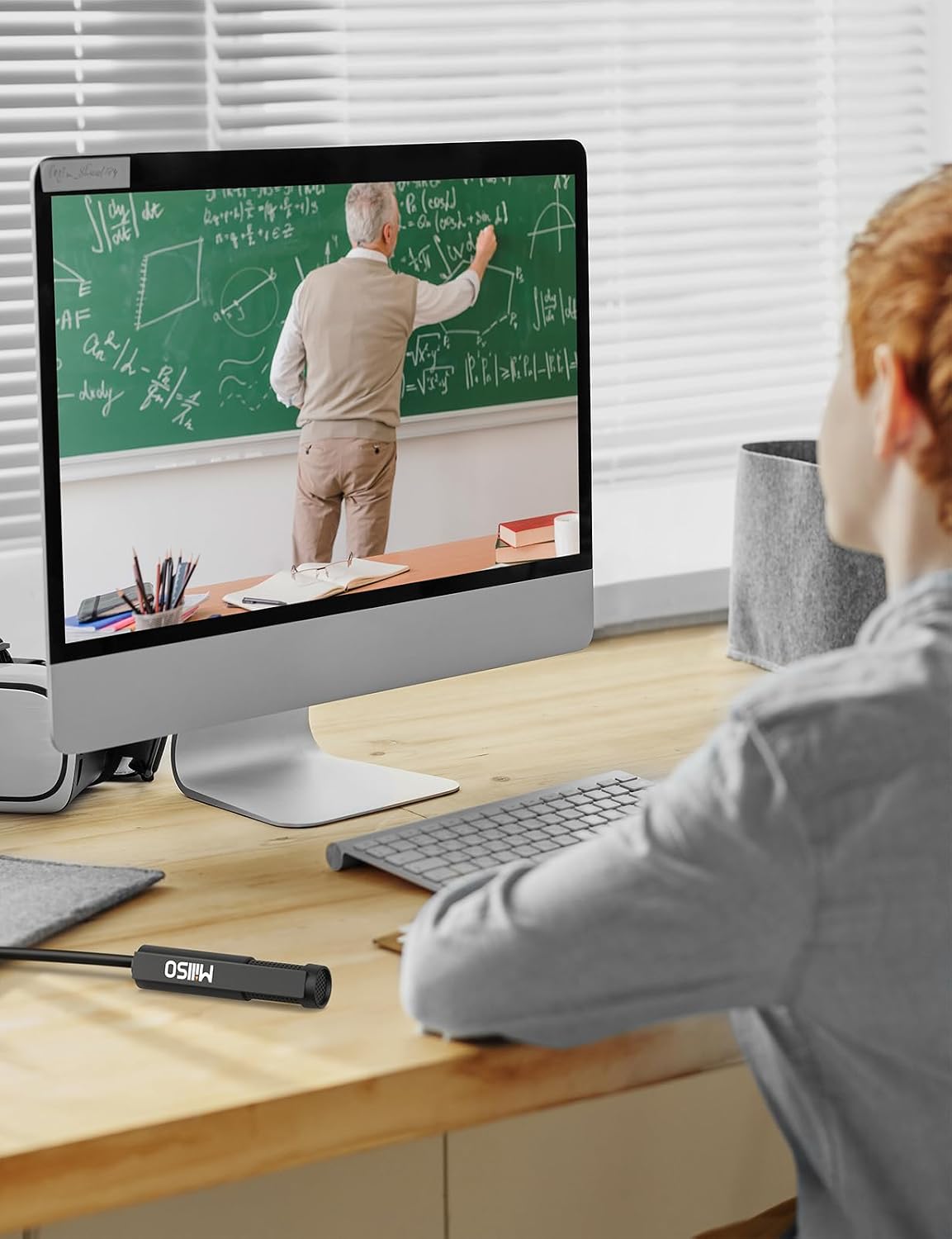 Student attending an online class using the MillSO USB Lavalier Microphone