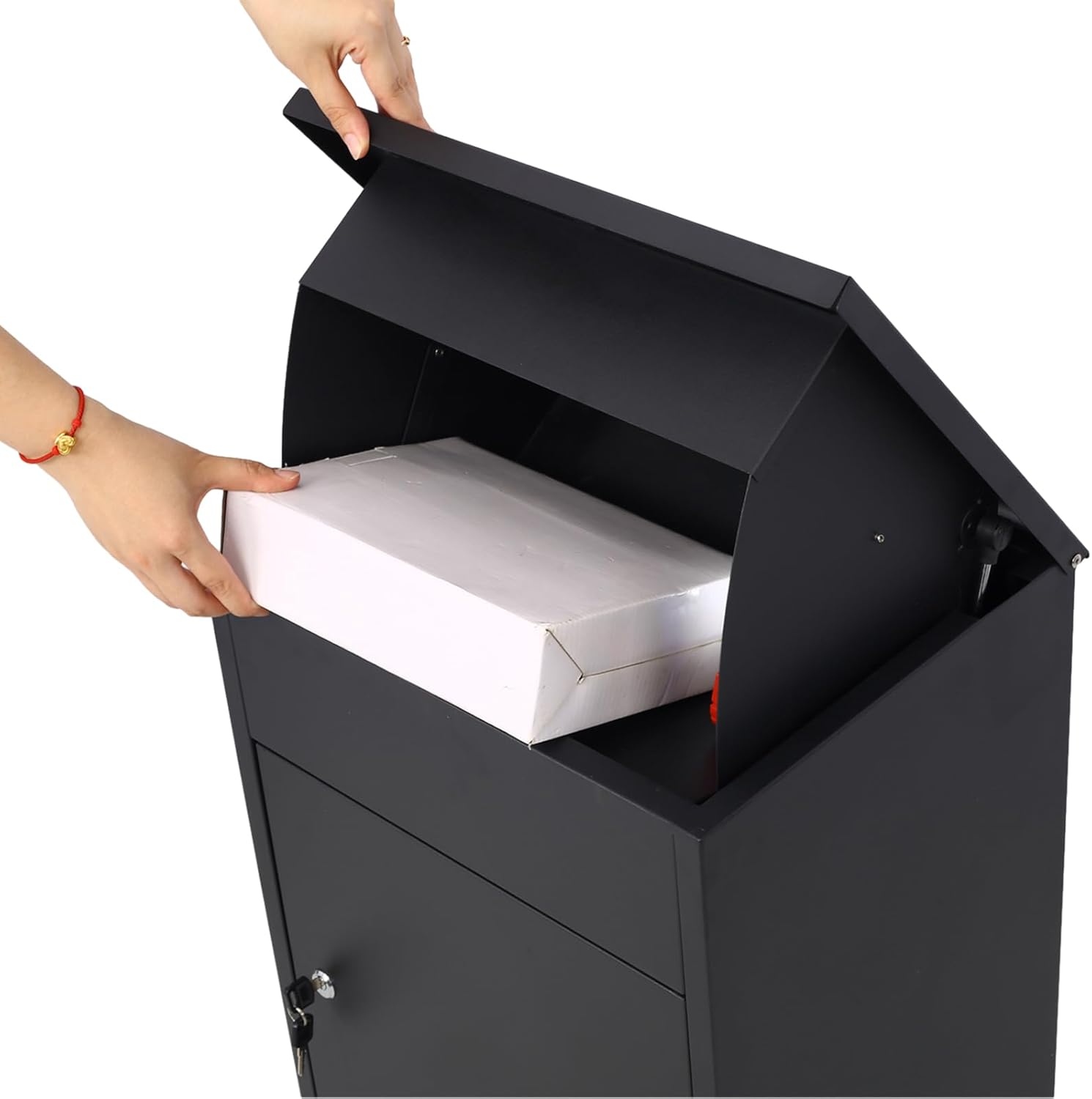 Hands placing a package into the open top slot of the mailbox.