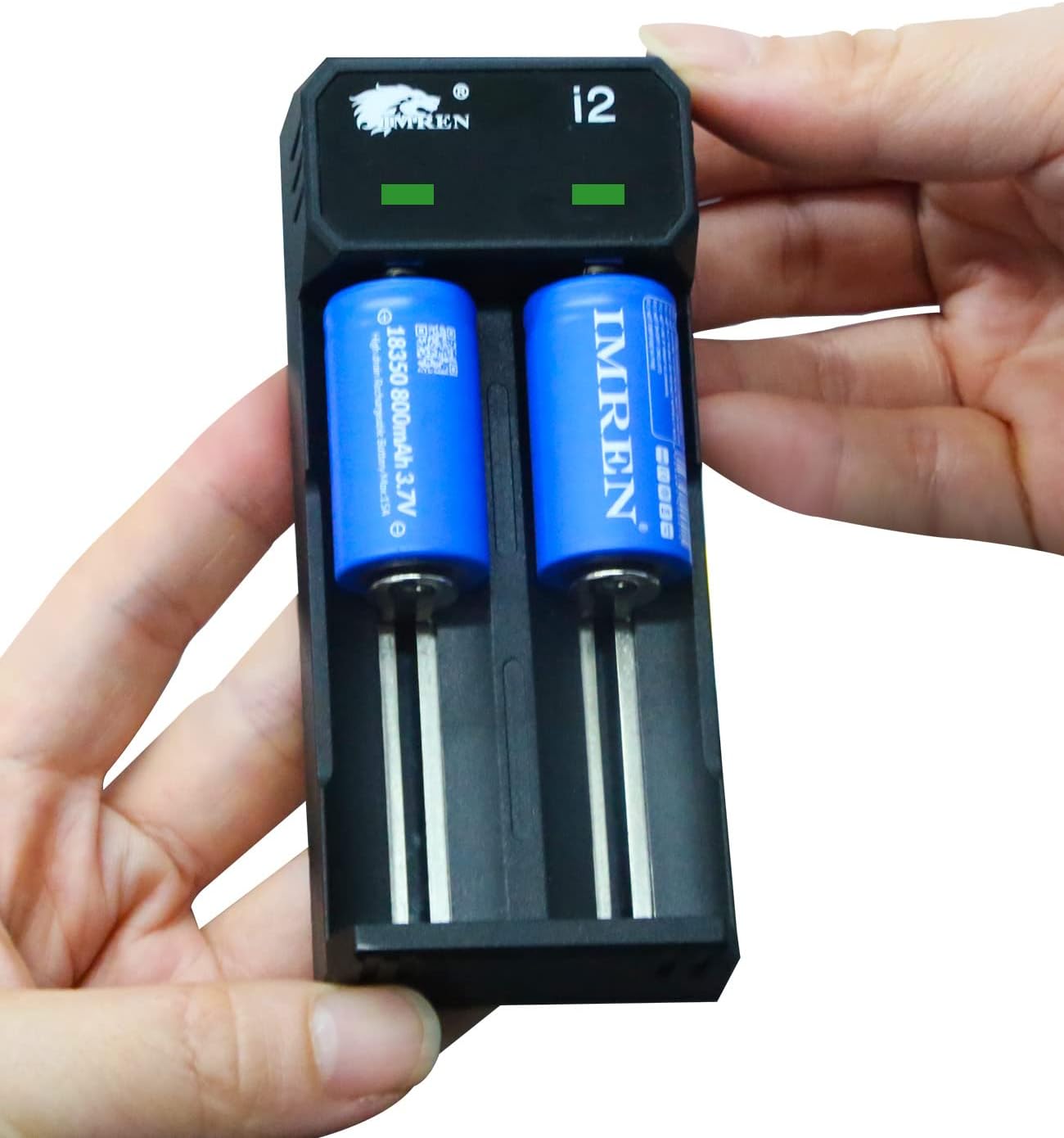 Hands holding the IMREN 18350 battery charger with two blue 18350 batteries inserted, showing the correct orientation.