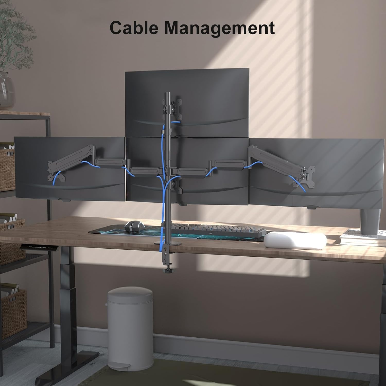 An image showing cables routed through the integrated cable management system of the monitor arm, keeping the desk tidy.