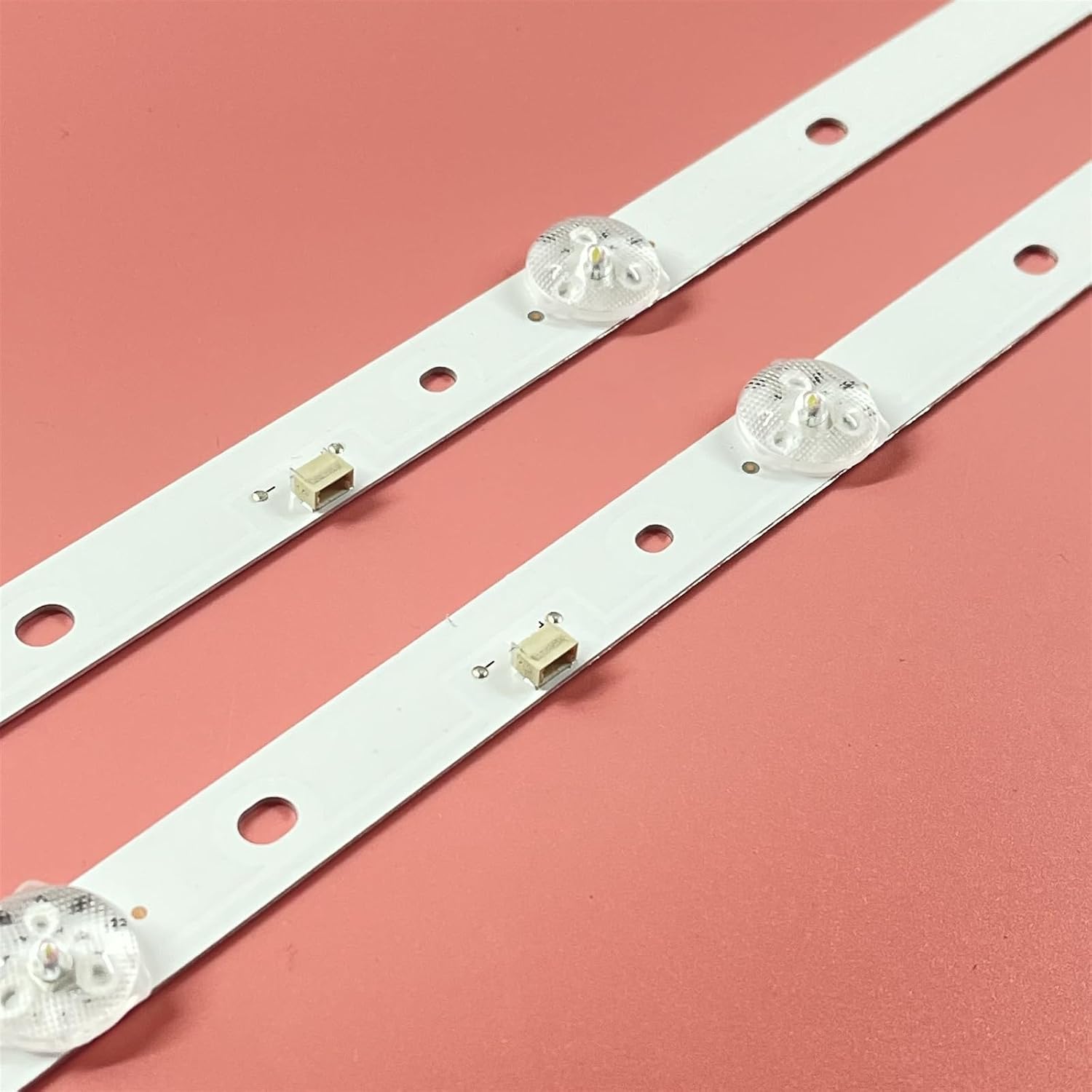 Close-up view of an LOTOAK LED backlight strip showing individual LED components and mounting holes.