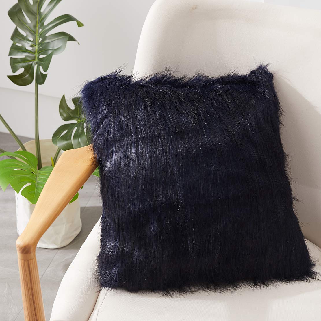 black fuzzy throw pillow