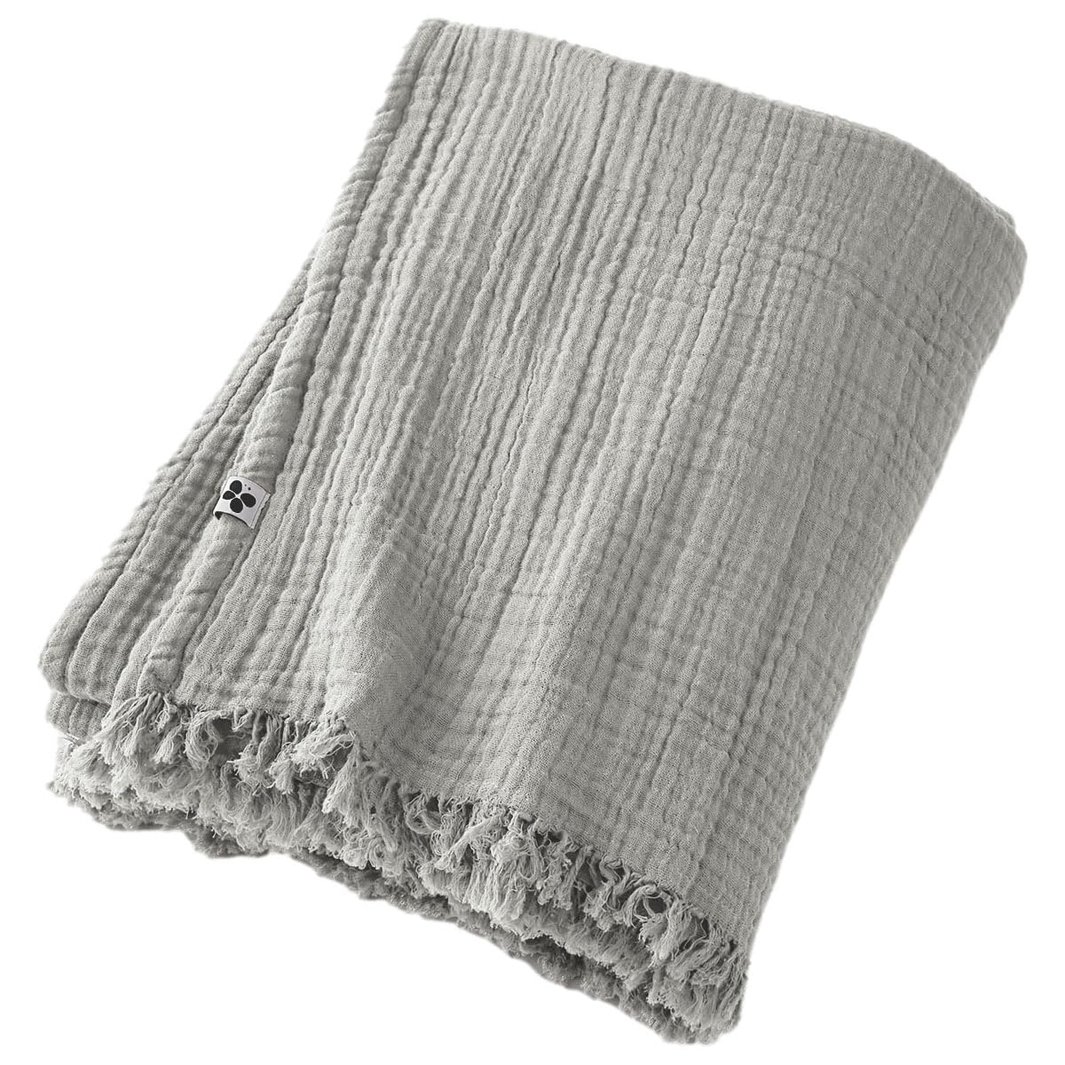 Plaid à franges en gaze de coton pour vos soirées cocooning au salon