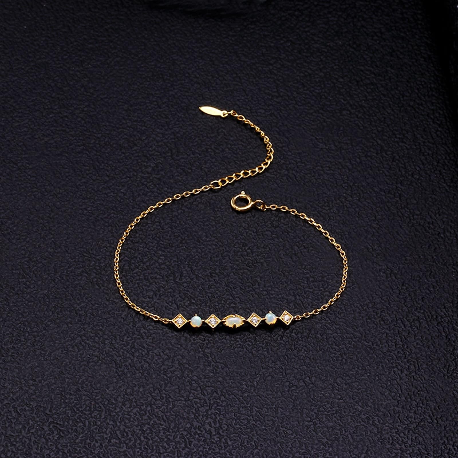 Au 375/585/750 - Bracciale in vero oro giallo con opale ovale classico