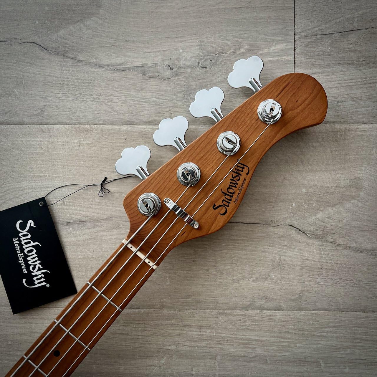 Close-up of the Sadowsky MetroExpress bass headstock with tuning machines