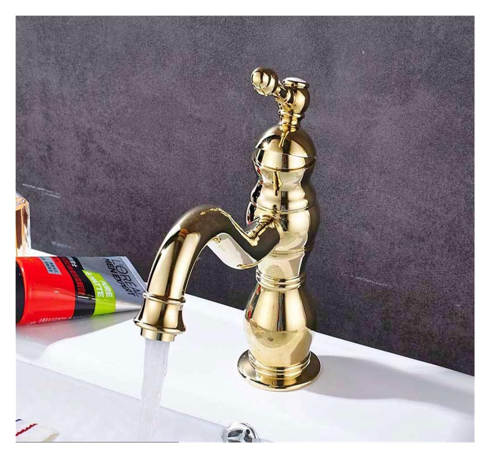 Mitigeur de lavabo doré avec bec pivotant pour installation sur comptoir