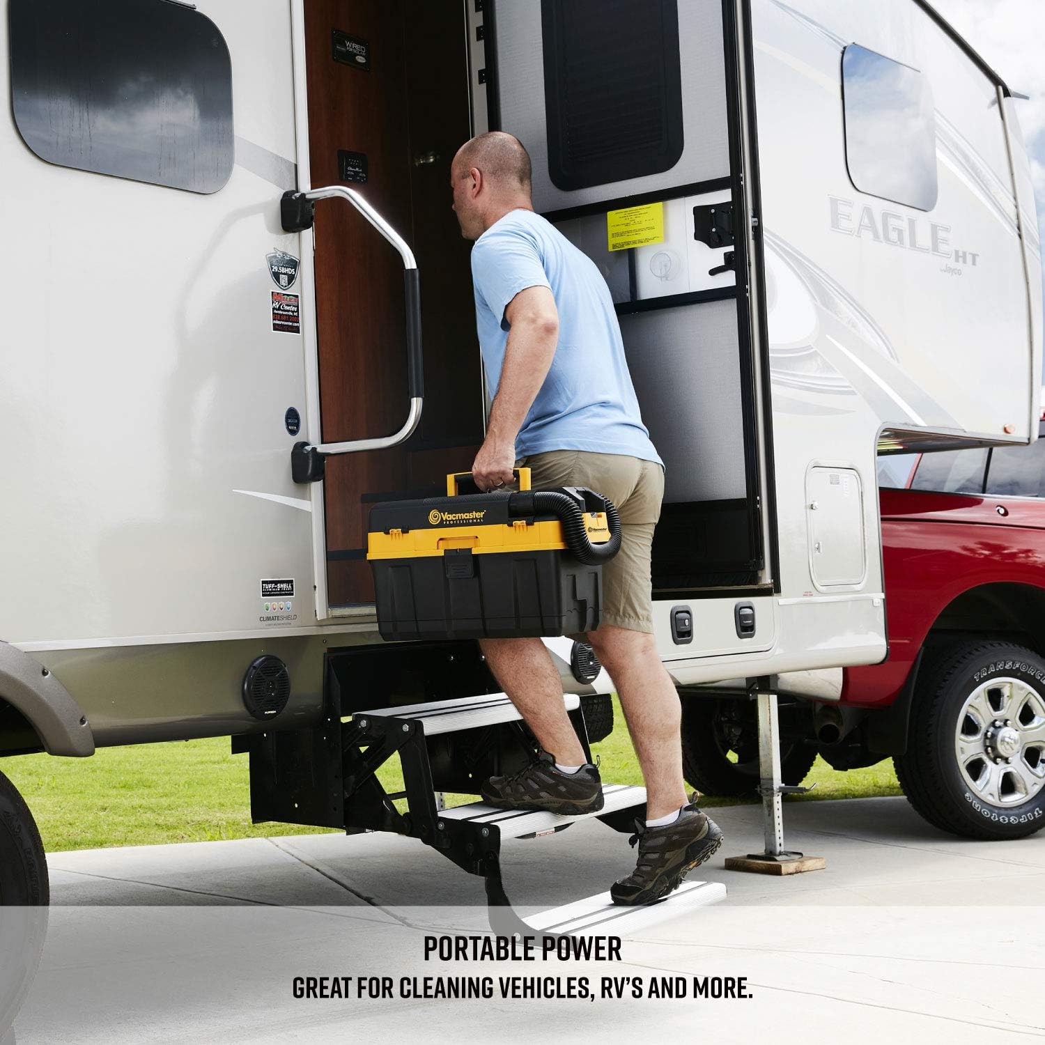 Man carrying Vacmaster DVTB204 with shoulder strap