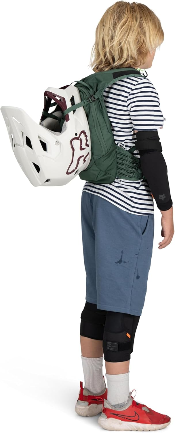 Child wearing Osprey Raptor Jr backpack, back view