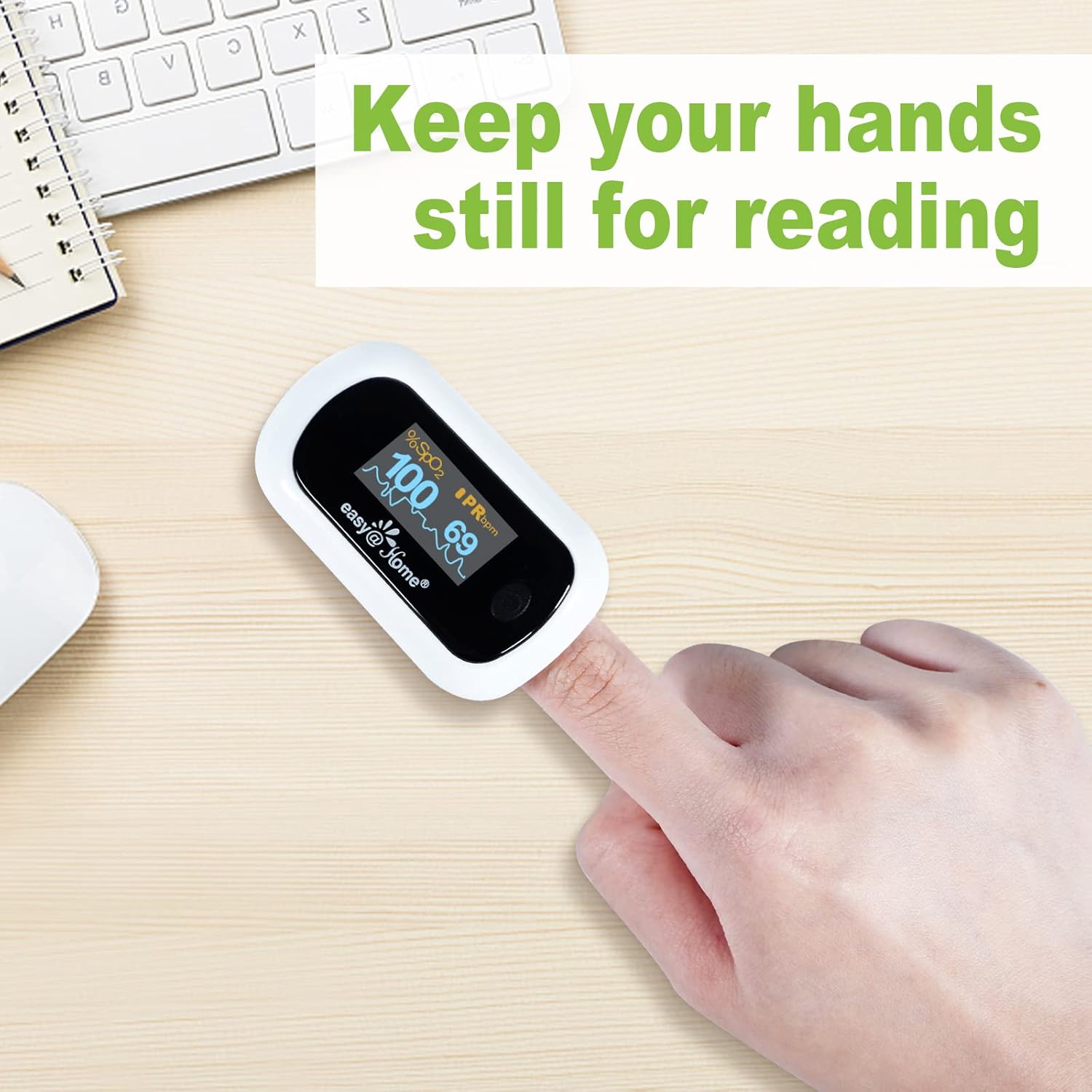 Hand with oximeter on finger, text 'Keep your hands still for reading'