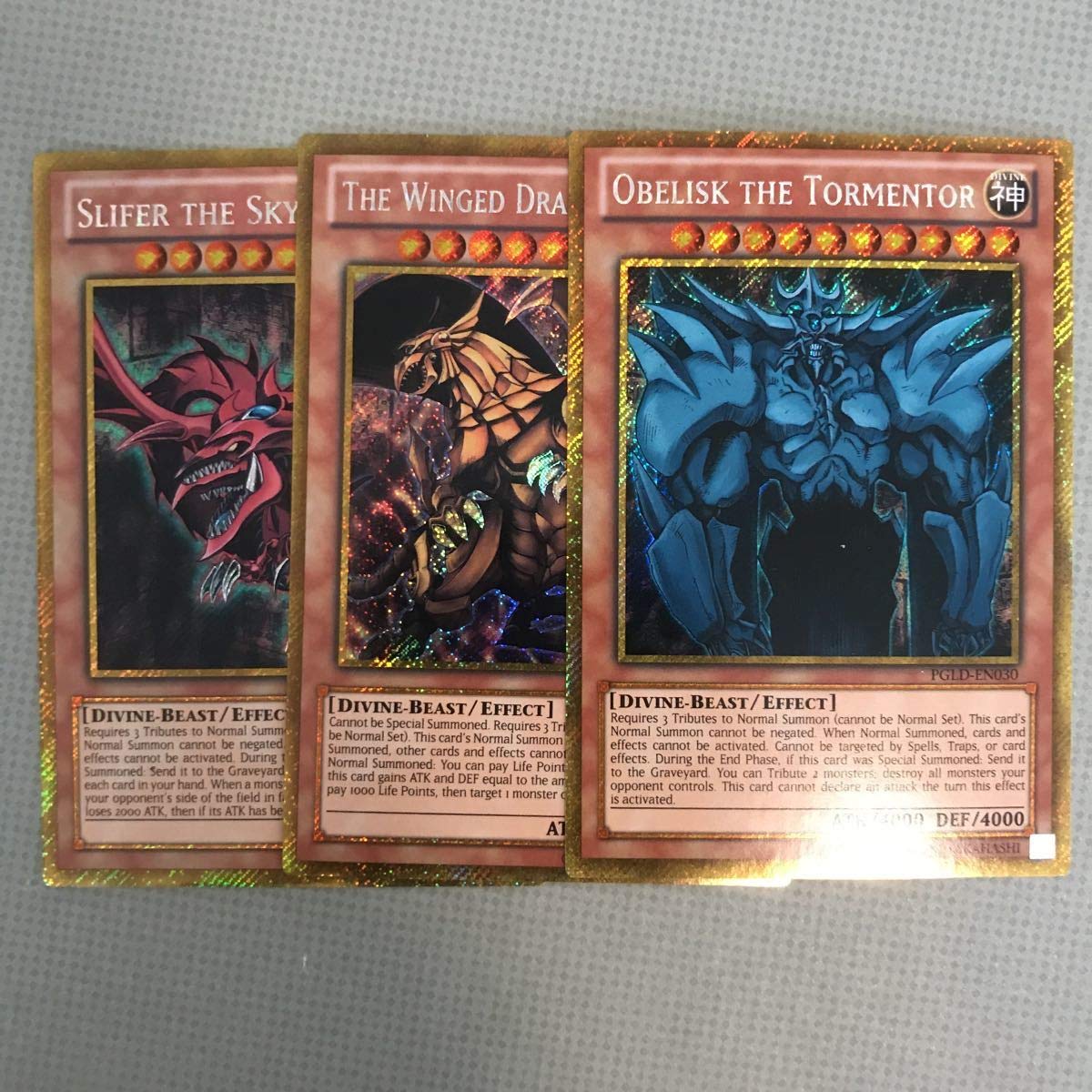 Amazon.co.jp: 英語 PGLD アンリミ 三幻神 ラーの翼神竜 オベリスクの 
